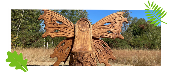 Carved wooden bench in the shape of a butterfly