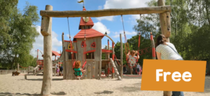 Sand play area with children on swings