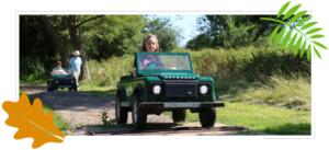 Girl driving a mini Land Rover at Moors Valley
