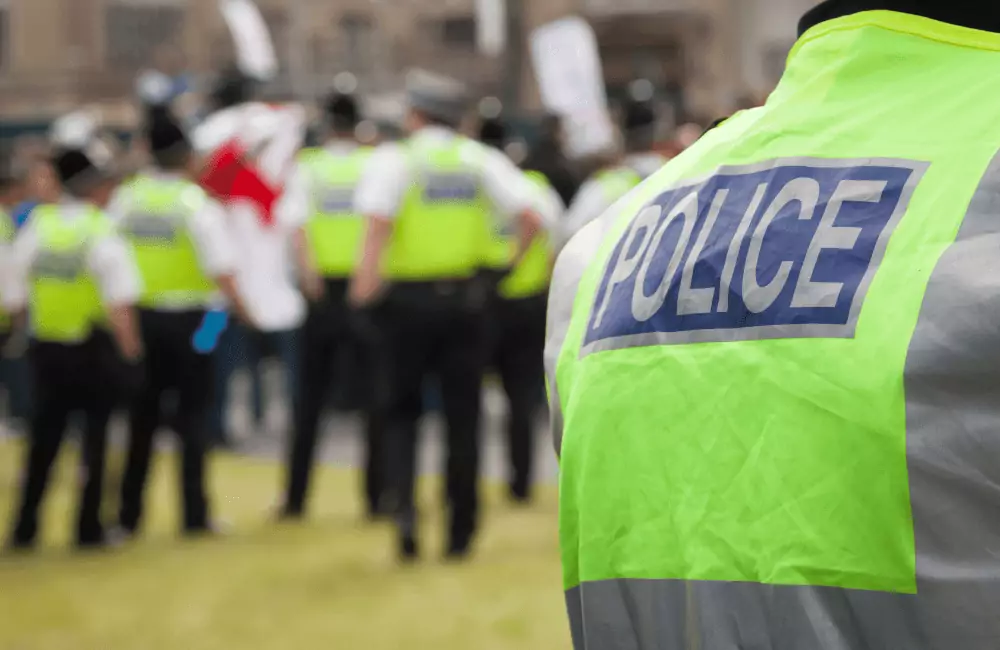 back of hi vis jackets, with 'police' written in large